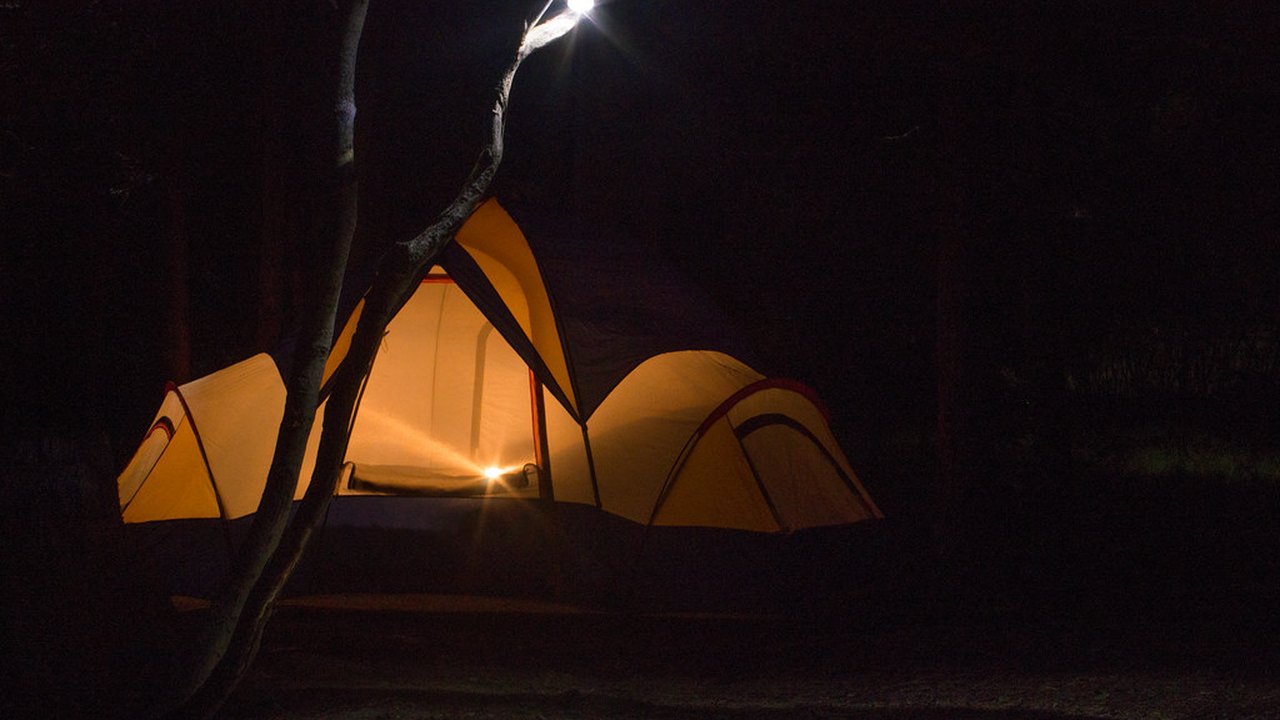 Battery lantern lighting a tent as an emergency light