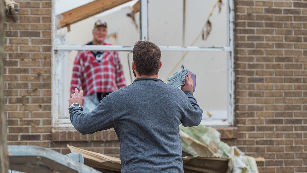 Neighbors checking on each other after tornado storm damage