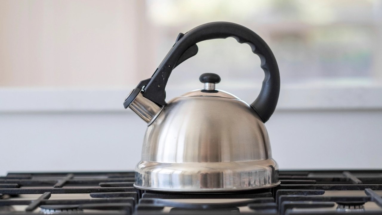 Steel kettle boiling water for safe drinking water preparation