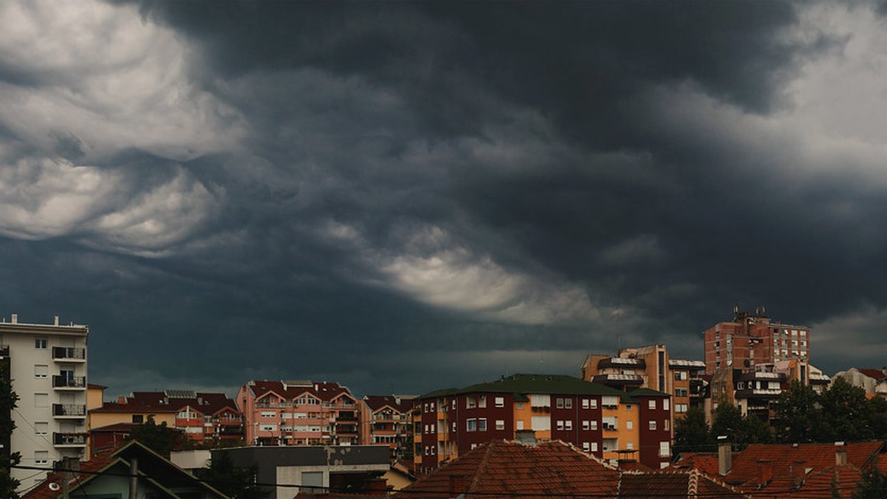 Dark storm clouds over a town before severe weather